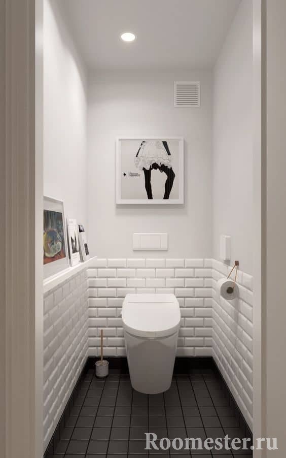 Маленький туалет в белом цвете с темным полом