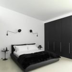 Белый интерьер спальни с черным шкафом-купе